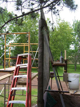 Outdoor landscape with red stepladder and orange scaffolding