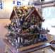 A small house covered in assorted objects